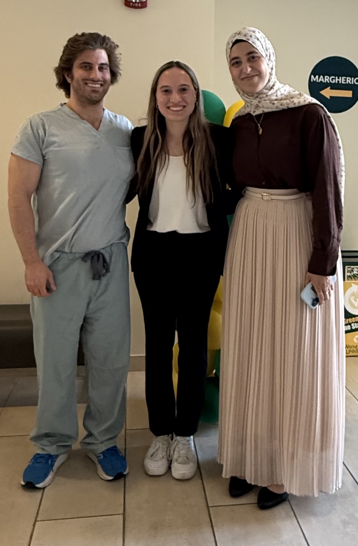 Gregory Schwing, Ashley Schehr and Razanne Zaghloul at the Preston M.
                    Hickey Medical Student Symposium